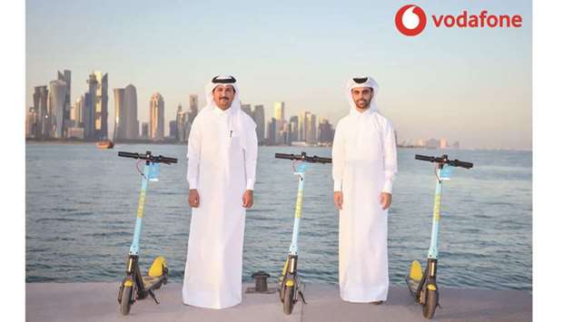 Vodafone Qatar Business Services director Mahday Saad al-Hebabi and Loop CEO Mohamed al-Mohannadi with the e-Scooters.