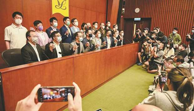 Pro-democracy lawmakers attend a press conference at the government headquarters in Hong Kong yesterday.