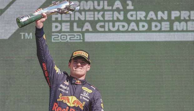 Red Bullu2019s Dutch driver Max Verstappen celebrates on the podium after winning the Formula One Mexico Grand Prix at the Hermanos Rodriguez racetrack in Mexico City on Sunday. (AFP)