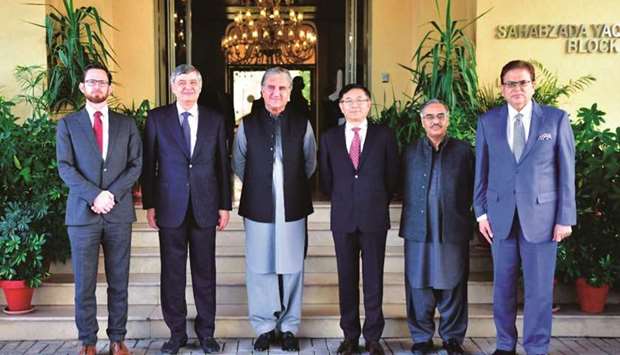 A group photograph of Pakistanu2019s Foreign Minister Shah Mahmood Qureshi with the envoys from the United States, China and Russia before the u2018Troika Plusu2019 group conference in Islamabad, yesterday.