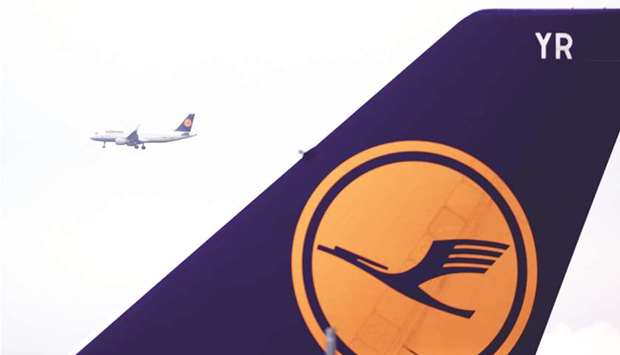 A logo on the tail fin of a Deutsche Lufthansa aircraft at Frankfurt Airport. The German airline group is working on a new rewards plan to coax customers into paying for its effort to clean up greenhouse-gas emissions, tapping into their desire to be seen as environmentally conscious.