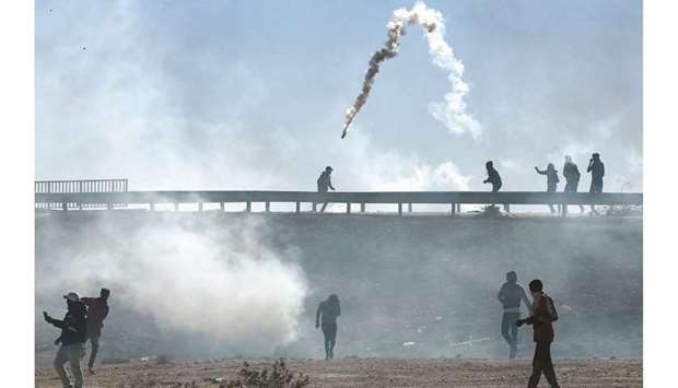 Smoke billows from tear gas fired by Tunisian security forces in the town of Agareb in the central region of Sfax on Thursday, two days after the death of a protester during angry demonstrations over the reopening of a rubbish dump.