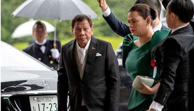 Philippines President Rodrigo Duterte arrives with daughter Sara Duterte-Carpio to attend the enthronement ceremony of Japan's Emperor Naruhito in Tokyo, Japan October 22, 2019. REUTERS