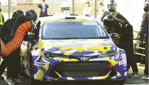 Toyotau2019s hydrogen engine racing car driven by its president Akio Toyoda is surrounded by pit crew members during a refuelling stop at Okayama International Circuit in Mimasaka, Okayama Prefecture on November 13. Toyotau2019s latest push into hydrogen tech comes as the worldu2019s biggest carmaker joins the rush to win a share of the growing market for battery electric vehicles (BEV) as the world tightens emission regulations to meet carbon-cutting pledges.