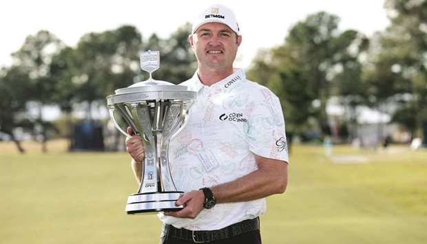 Jason Kokrak poses with the trophy after winning the Houston Open at the Memorial Park Golf Course in Houston. (AFP)