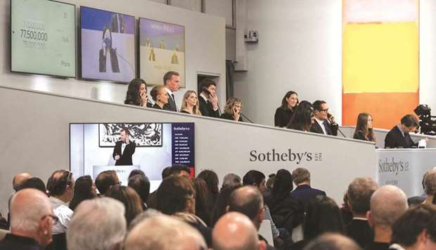 Mark Rothkou2019s u201cNo. 7u201d (R), which sold for $77,500,000 ($82.4mn fees and commisions included), is displayed during an auction of The Macklowe Collection, at Sothebyu2019s in New York City. (AFP)