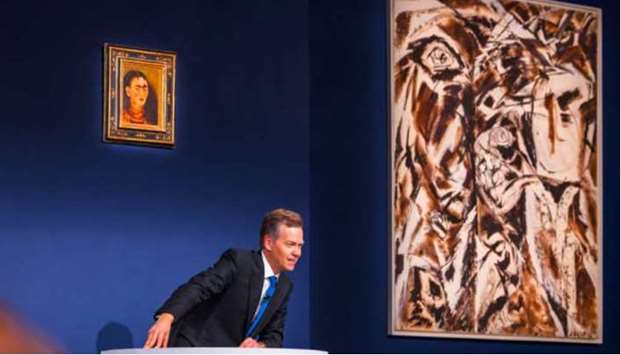 Auctioneer Oliver Barker, Chairman of Sotheby's Europe, sells a Frida Kahlo self portrait for $34.9 Million USD during an art auction, in the Manhattan borough of New York City, New York, U.S.
