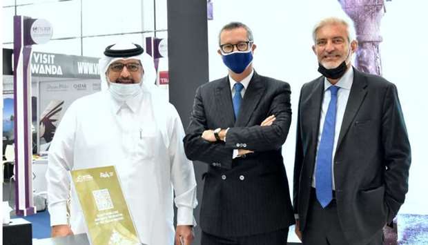 From left: Gulf Times Editor-in-Chief Faisal Abdulhameed al-Mudahka joins Italian ambassador Alessandro Prunas and Italian National Tourism Board president Giorgio Palmucci at the Italian pavilion during the launch of Qatar Travel Mart 2021 yesterday. Right: The Italian pavilion at Qatar Travel Mart 2021, which will run until November 18 at the Doha Exhibition and Convention Centre (DECC). PICTURES: Thajudheen