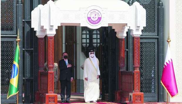 Accompanied by His Highness the Amir Sheikh Tamim bin Hamad al-Thani, Brazilian President Jair Bolsonaro being accorded an official reception ceremony