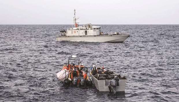 This handout picture released yesterday, by Doctors Without Borders (MSF) shows MSF members of the Geo Barents crew taking part in a search and rescue operation to rescue migrants at approximatively 30 miles from the Libyan shores.