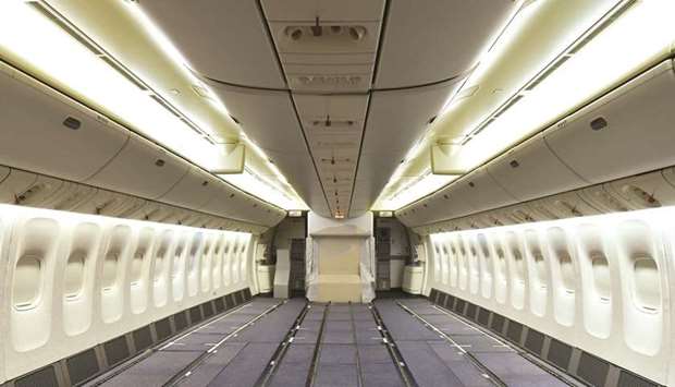A general view of an Emirates Airlinesu2019 Boeing 777-300ER aircraft being modified to provide additional cargo capacity with seats removed from the economy class cabin in Dubai (file). At Emirates, the passenger jet fleet accounts for about 70% of its total cargo capacity.