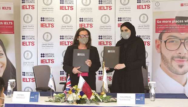British Council's Sam Ayton and Lusail University's Fatima al-Mesleh at the signing ceremony.
