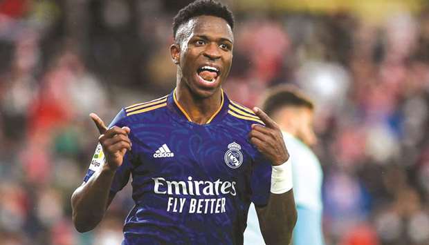 Real Madridu2019s Brazilian forward Vinicius Junior celebrates after scoring his teamu2019s third goal during the La Liga match against Granada at the Nuevo Los Carmenes Stadium in Granada yesterday. (AFP)