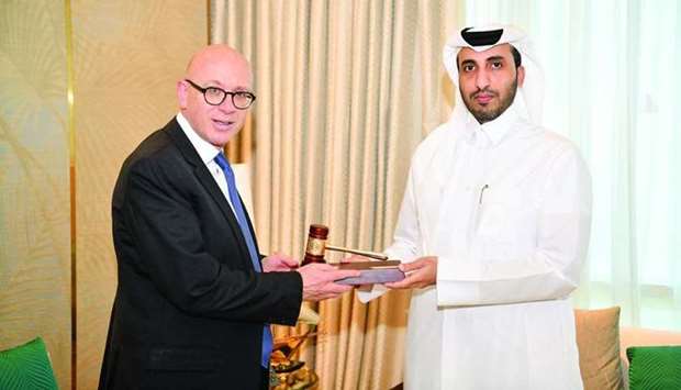 Faisal Rashid al-Sahouti honours Lord Wolfson at the Qatar International Court Monday