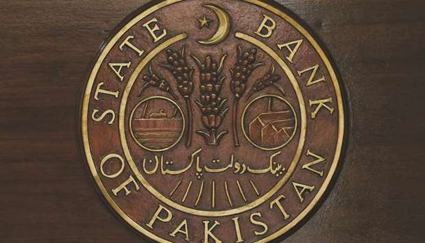 A logo of the State Bank of Pakistan (SBP) is pictured on a reception desk at the head office in Karachi (file). The central bank last week warned that a higher than expected primary deficit would likely worsen the inflation outlook and undermine economic recovery.