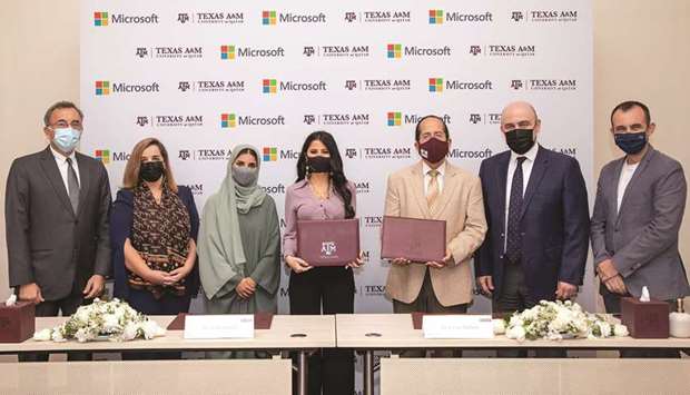 Microsoft and Tamuq officials at the signing ceremony.