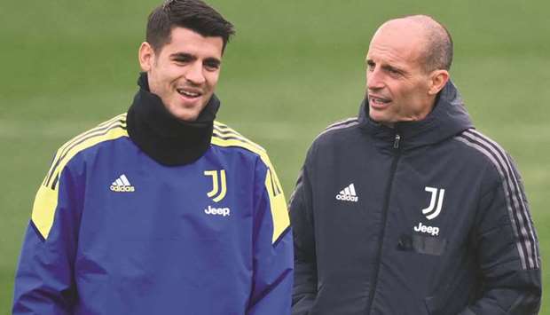 Juventusu2019 forward Alvaro Morata (left) and head coach Massimiliano Allegri attend a training session yesterday in Turin, on the eve of their Champions League Group H match against Chelsea. (AFP)