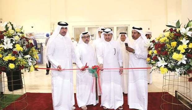 Al Meera officials and representatives from the Central Municipal Council and the Ministry of Commerce and Industry during the opening ceremony. 