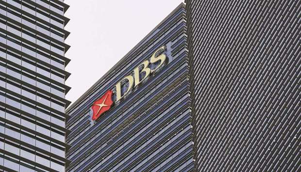 The DBS Group Holdings logo is displayed atop Tower 3 of the Marina Bay Financial Centre in Singapore. Singaporeu2019s central bank said it will consider supervisory actions after DBS Group suffered one of the worst digital disruptions for Southeast Asiau2019s biggest lender in the past decade.