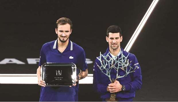 Serbiau2019s Novak Djokovic (right) with Russiau2019s Daniil Medvedev.