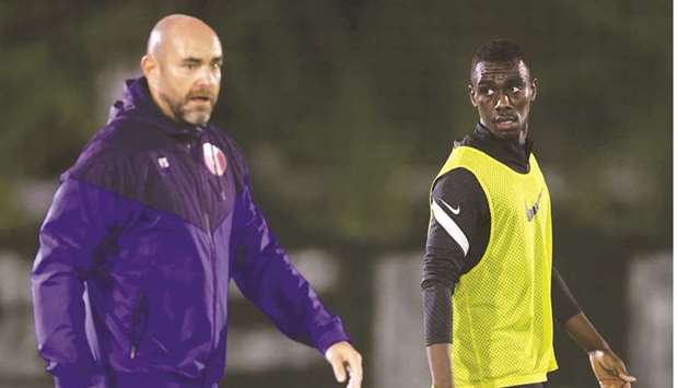 Qatar coach Felix Sanchez (left) and striker Almoez Ali at a training session in Marbella, Spain.