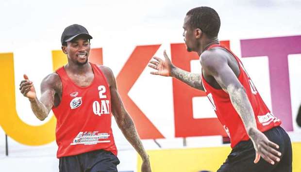 Qataru2019s Cherif Younousse (right) and Tijan Ahmed celebrate after their win over Japanu2019s Yoshiumi Hasegawa and Takashi Tsuchiya at the Asian Beach Volleyball Championships in Phuket, Thailand, on Thursday.