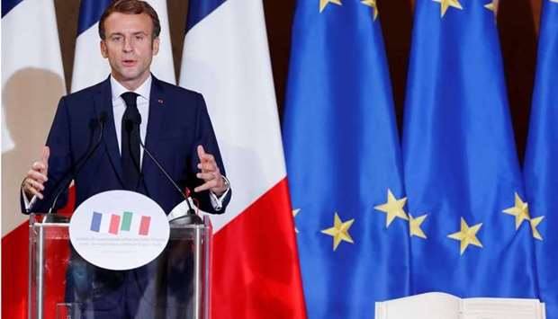 French President Emmanuel Macron speaks during a news conference after signing an accord with Italy's Prime Minister Mario Draghi to try to tilt the balance of power in Europe, at Villa Madama in Rome, Italy. REUTERS