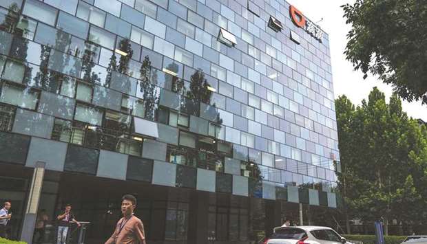 Didi Global headquarters in Beijing. Chinese regulators have asked Didiu2019s top executives to devise a plan to delist from US bourses, people familiar with the matter said, an unprecedented request thatu2019s likely to revive fears about Beijingu2019s intentions for its giant tech industry.