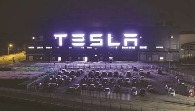 The Tesla Gigafactory stands illuminated at night in Shanghai. Tesla plans to invest as much as $188mn in its Shanghai plant to upgrade equipment as the factory gets closer to exhausting its current capacity, according to people familiar with the matter.