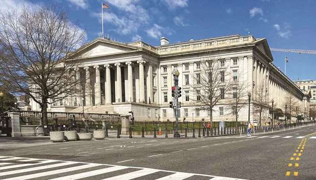 The US Treasury Department building in Washington. Benchmark Treasury yields were on track for the biggest drop since the early months of the pandemic and money markets offloaded bets on central bank interest-rate hikes amid concerns that a new coronavirus strain may spread globally and slow economic growth.