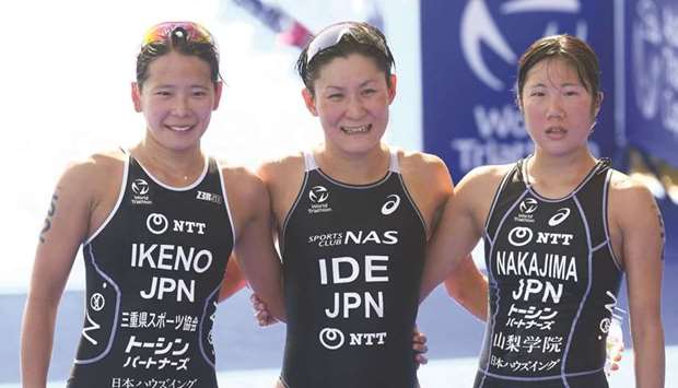 Japanu2019s Juri Ide (centre) is seen with countrywomen Minori Ikeno (left) and Chisato Nakajima after winning the Elite Race of the QNB Asia Triathlon Cup Doha at the Lusail Marina on Friday.