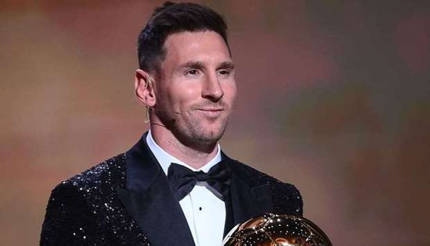 Paris Saint-Germain's Argentine forward Lionel Messi poses after being awarded the the Ballon d'Or award during the 2021 Ballon d'Or France Football award ceremony at the Theatre du Chatelet in Paris