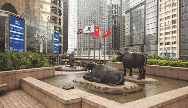 Sculptures stand outside the Hong Kong Stock Exchange. The Hang Seng Index closed down 1.9% to 23,393.74 points yesterday.