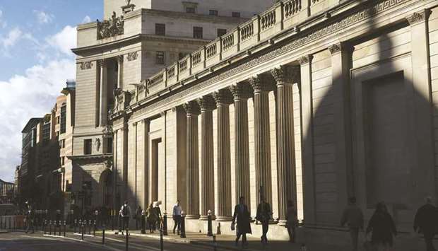 The Bank of England in the City of London. The advent of the Omicron variant of the coronavirus risks posing new challenges for central bankers by threatening economic growth while adding to inflation pressures.