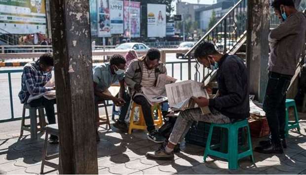 People read local newspapers in a downtown area of the city of Addis Ababa, Ethiopia.