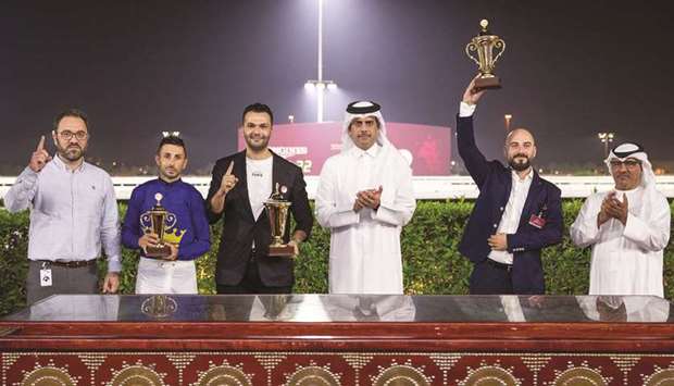 President of Qatar and Asian Equestrian Federations and QREC Vice Chairman Hamad Bin Abdulrahman al-Attiyah (third right) crowned the winners of Al Gharafa Cup at Al Rayyan Racecourse yesterday. PICTURE: Juhaim