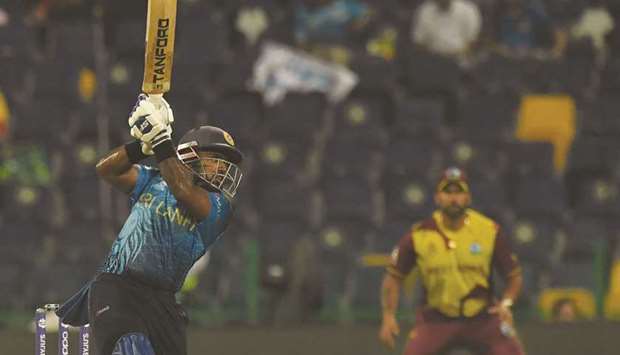Sri Lankau2019s Charith Asalanka plays a shot during the ICC Twenty20 World Cup match against West Indies in Abu Dhabi yesterday. (AFP)