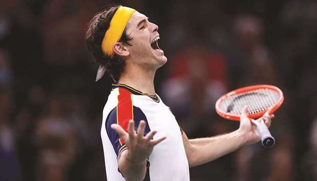Taylor Fritz of the US celebrates winning his round of 16 match against Britainu2019s Cameron Norrie at the Paris Masters yesterday. (Reuters)