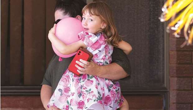 Cleo Smith and her mother Ellie Smith leave a house where the girl spent her first night after being rescued in Carnarvon, Australia, yesterday.