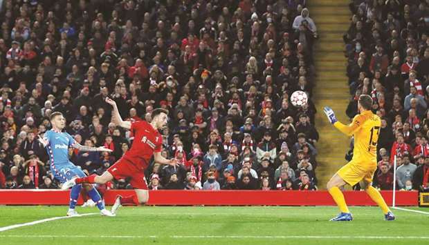 Liverpoolu2019s Diogo Jota (centre) scores against Atletico Madrid during the Champions League match on Wednesday. (Reuters)