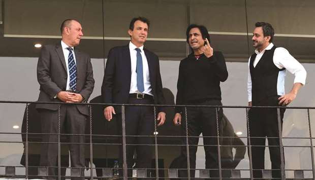 PCB chairman Ramiz Raja (second from right), ECB chief executive officer Tom Harrison (second from left), ECB deputy chairman Martin Darlow (left) and PCB chief operation officer Salman Naseer talk during their visit to the Gaddafi Cricket Stadium in Lahore yesterday. (AFP)