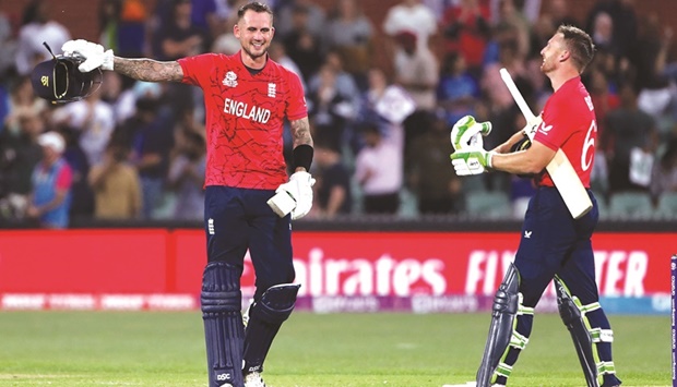 Englandu2019s Captain Jos Buttler (right) and Alex Hales celebrate their teamu2019s win in the ICC Twenty20 World Cup 2022 semi-final against India at the Adelaide Oval in Adelaide yesterday. (AFP)