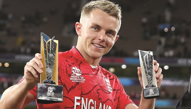 Englandu2019s Sam Curran displays his trophies after the ICC Twenty20 World Cup 2022 final against Pakistan at Melbourne Cricket Ground on Sunday. (AFP)