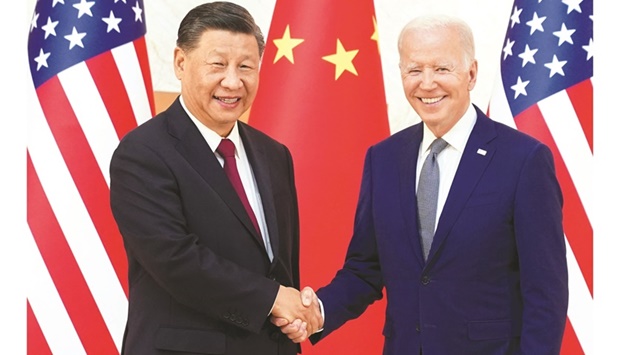 US President Joe Biden (right) shakes hands with Chinese President Xi Jinping as they meet on the  sidelines of the G20 leadersu2019 summit in Bali, Indonesia, yesterday. (Reuters)