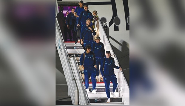 England team arrives at the Hamad International Airport yesterday. (AFP)