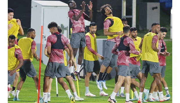 Qataru2019s players attend a training session at the Aspire Academy training pitch yesterday. (AFP)