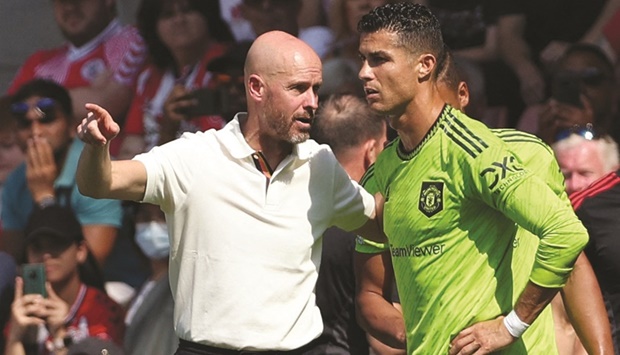In this file photo taken on August 27, 2022, Manchester Unitedu2019s Dutch manager Erik ten Hag (left) directs substitute Manchester Unitedu2019s Portuguese striker Cristiano Ronaldo during the Premier League match against Southampton at the St Maryu2019s Stadium in Southampton, England. (AFP)