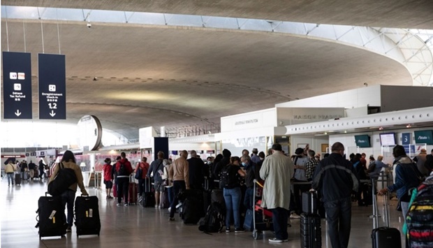 Travellers queue at the Ailitalia and Air France-KLM flight check in desks at Charles de Gaulle Airport in France. Passengers seek convenience when they plan their travel and when choosing where to depart from. Their preference is to fly from an airport close to home, have all booking options and services available in one single place, pay with their preferred payment method and easily offset their carbon emissions, a recent survey by the International Air Transport Association reveals.