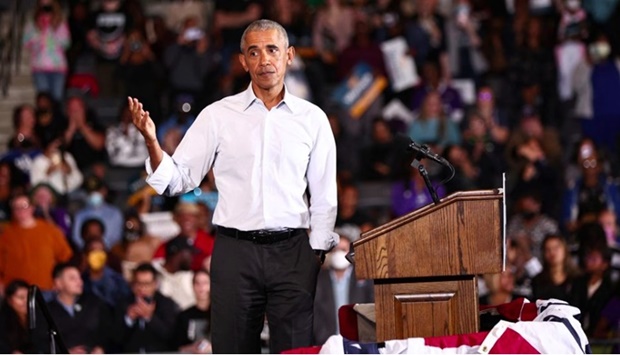 Former U.S. president Barack Obama gestures at a campaign rally for Senator Raphael Warnock ahead of the midterm elections in Atlanta, Georgia, US, October 28, 2022.