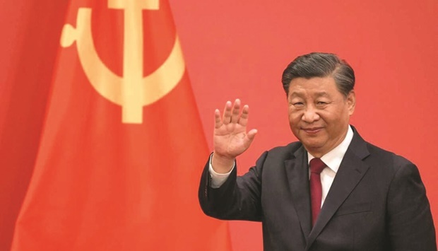 Chinese President Xi Jinping waves during the introduction of members of the Chinese Communist Partyu2019s new Politburo Standing Committee, the nationu2019s top decision-making body, to the media in the Great Hall of the People in Beijing last month. (AFP)